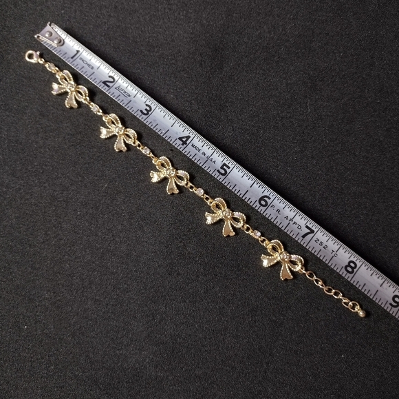 Gold And Rhinestone Bow Bracelet - Picture 9 of 9